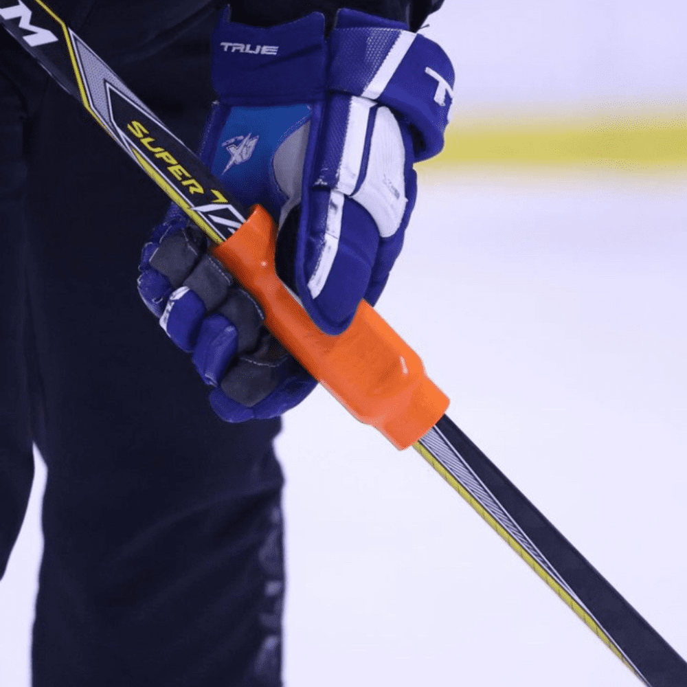 Close-up of Power Sleeve® hockey training aid improving grip strength and stick handling.